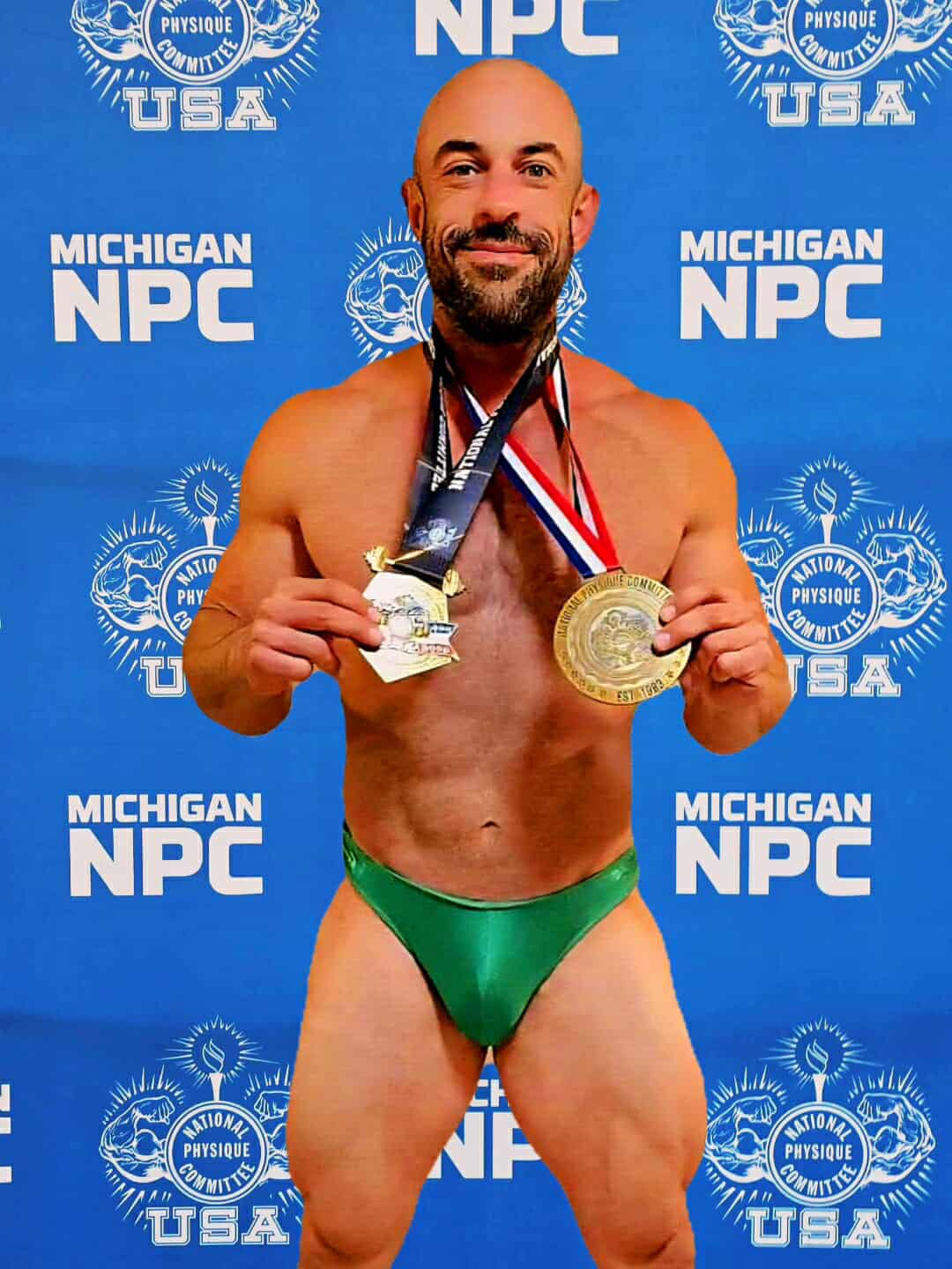 Stage front pose green trunks